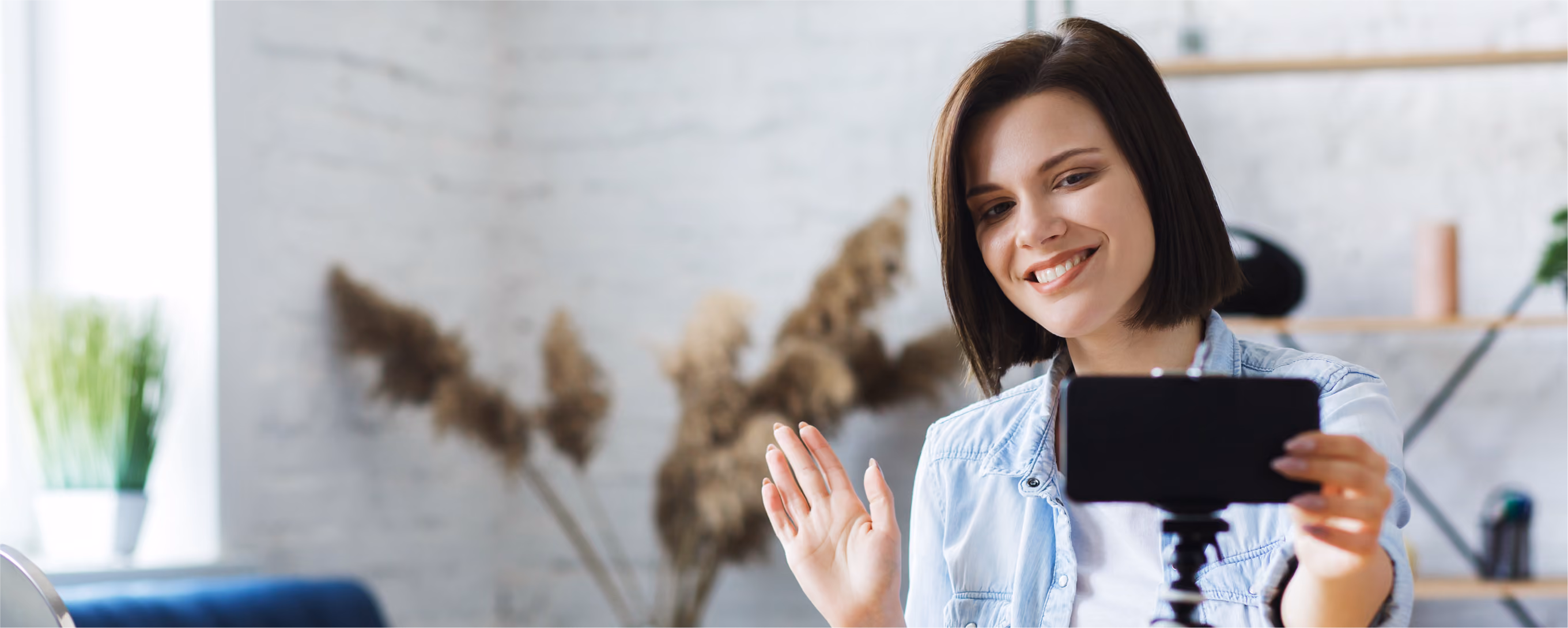 woman filming herself with a smartphone