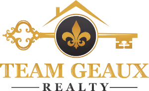 Team Geaux Realty logo with a gold key and fleur-de-lis symbol inside a black circle.