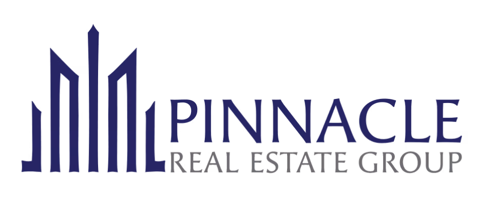 Pinnacle Real Estate Group logo with stylized building spires in navy and gray text.