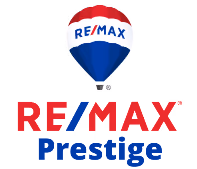 Red, white, and blue hot air balloon above red RE/MAX and blue Prestige text.