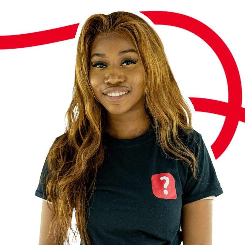 Smiling young woman with long wavy hair wearing a black t-shirt with a red question mark logo.