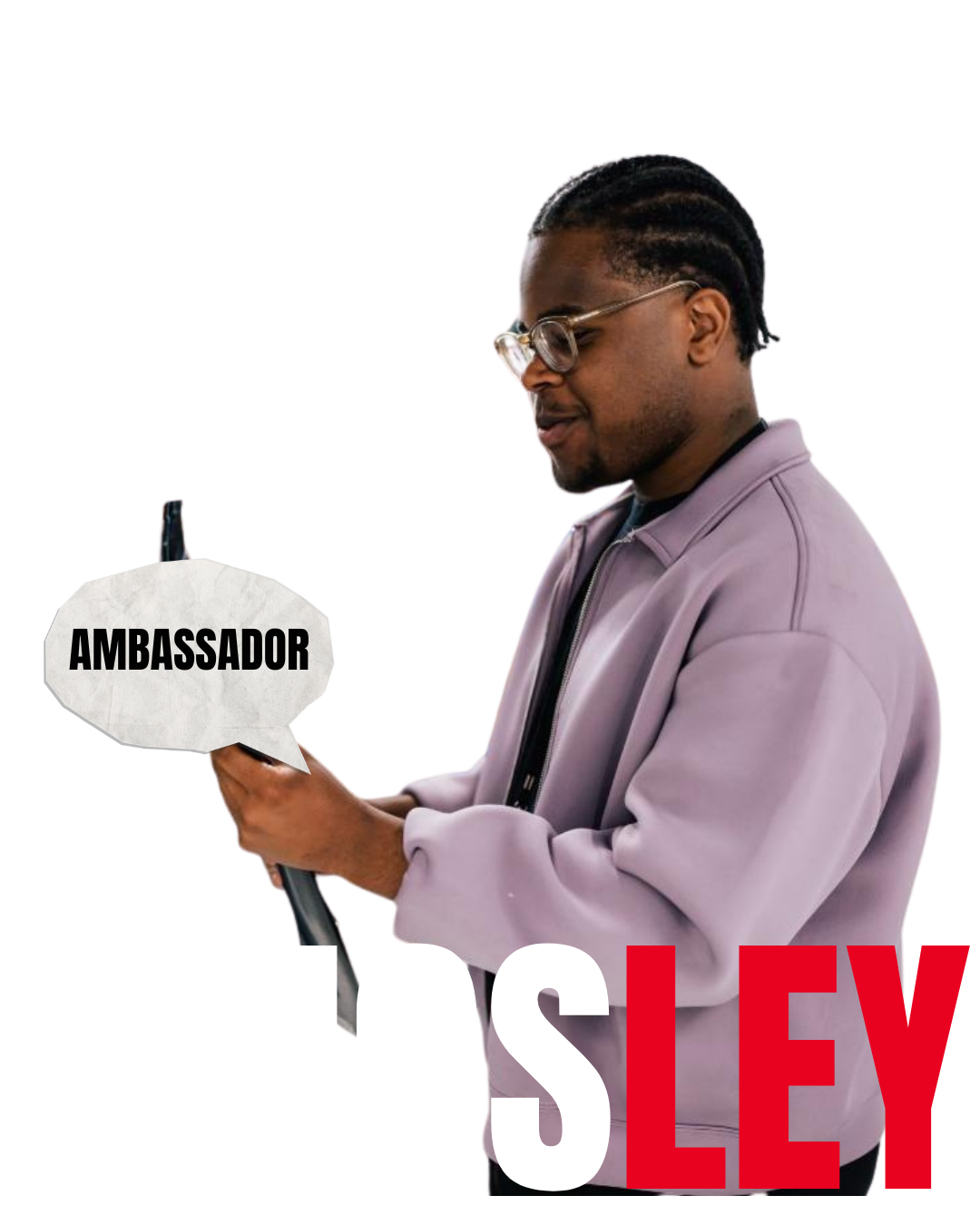 Man with braided hair and glasses wearing a lavender jacket holding a black umbrella with a speech bubble that says 'AMBASSADOR', with large text reading 'KINGSLEY'.