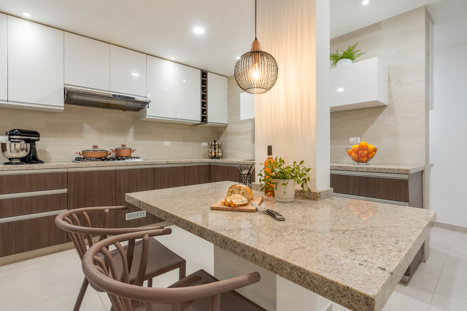 Contemporary kitchen with beige granite island.