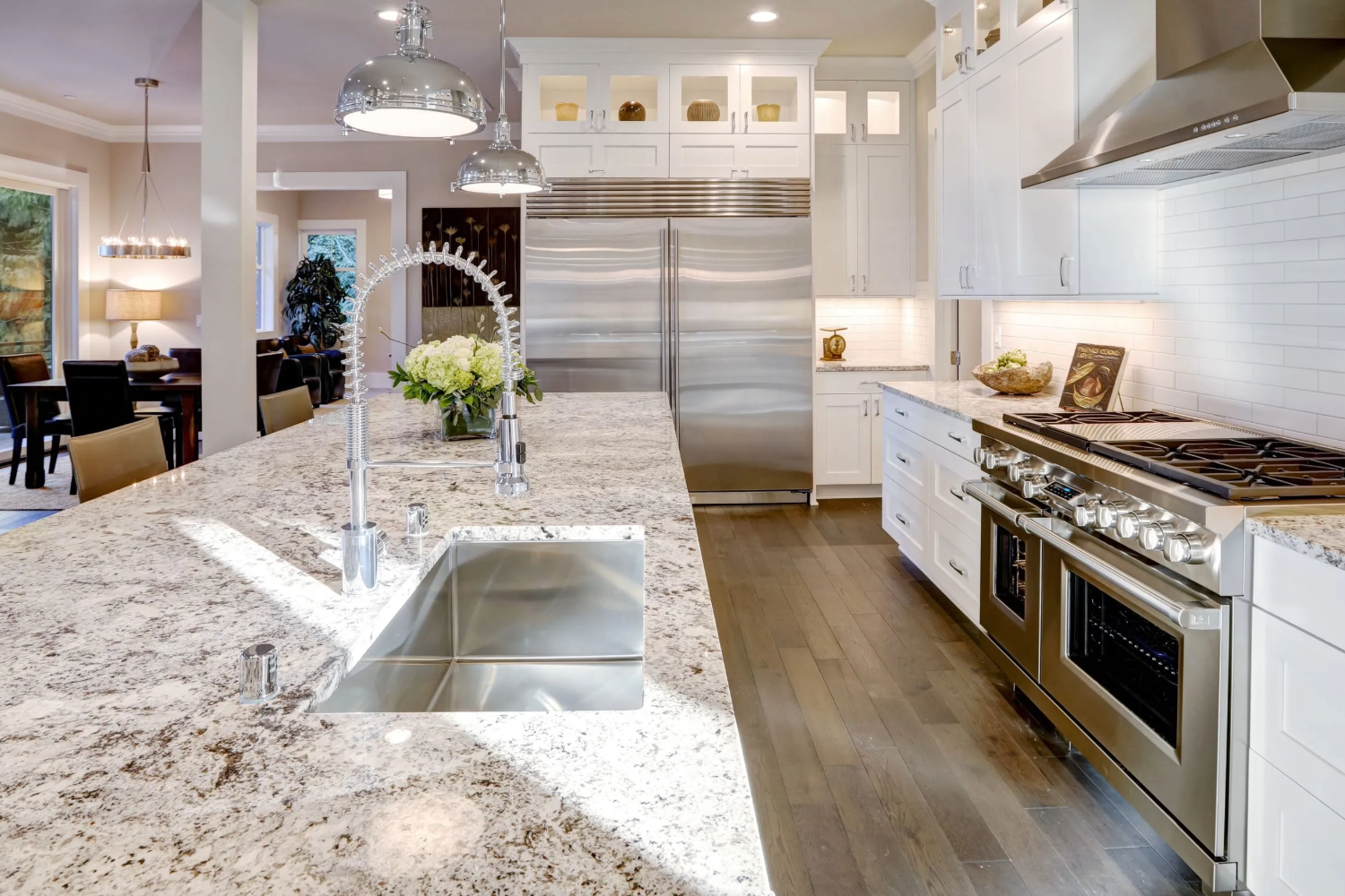 Luxury kitchen with granite island and stainless steel appliances