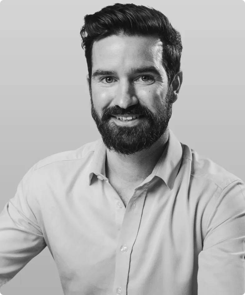 A black and white photo of Pat Krouse, the VP of Operations and Sales at Rev..