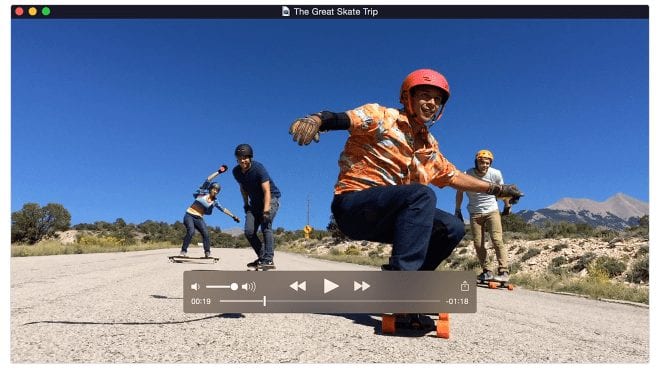 A quicktime video showing a group of boys skateboarding on a street