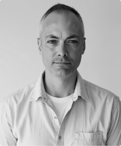 A black and white photo of Michael Lane, the VP of Development for Rev.