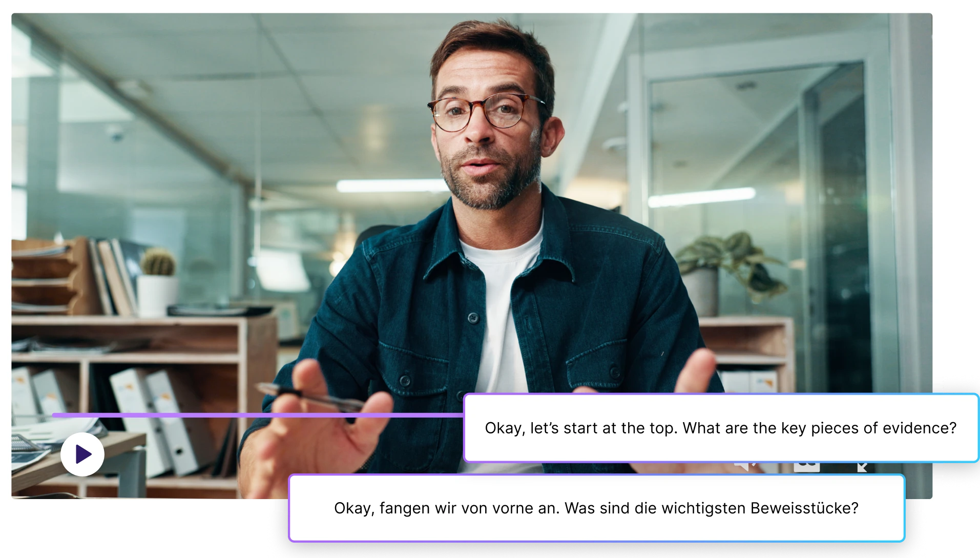 Man speaking on video with English and German subtitles displayed simultaneously.