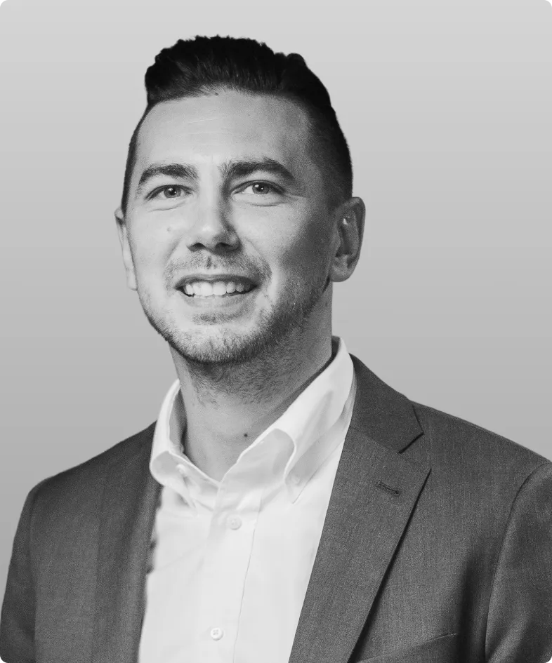 A black and white photo of Chance Shiflett, the Head of Product at Rev.
