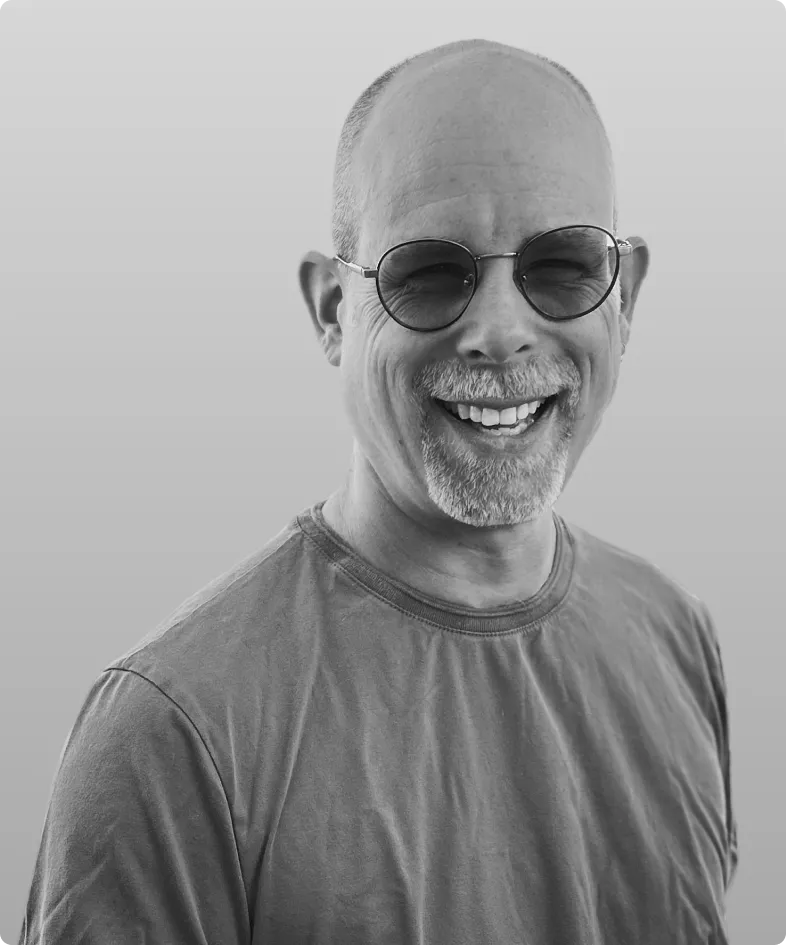 A black and white photo of Todd Parnell, the SVP of Engineering at Rev.