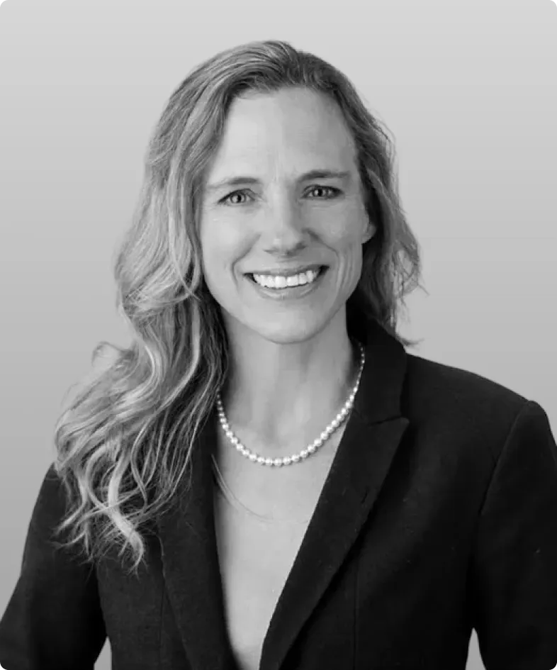 A black and white photo of Angela Pierce, the CFO at Rev.