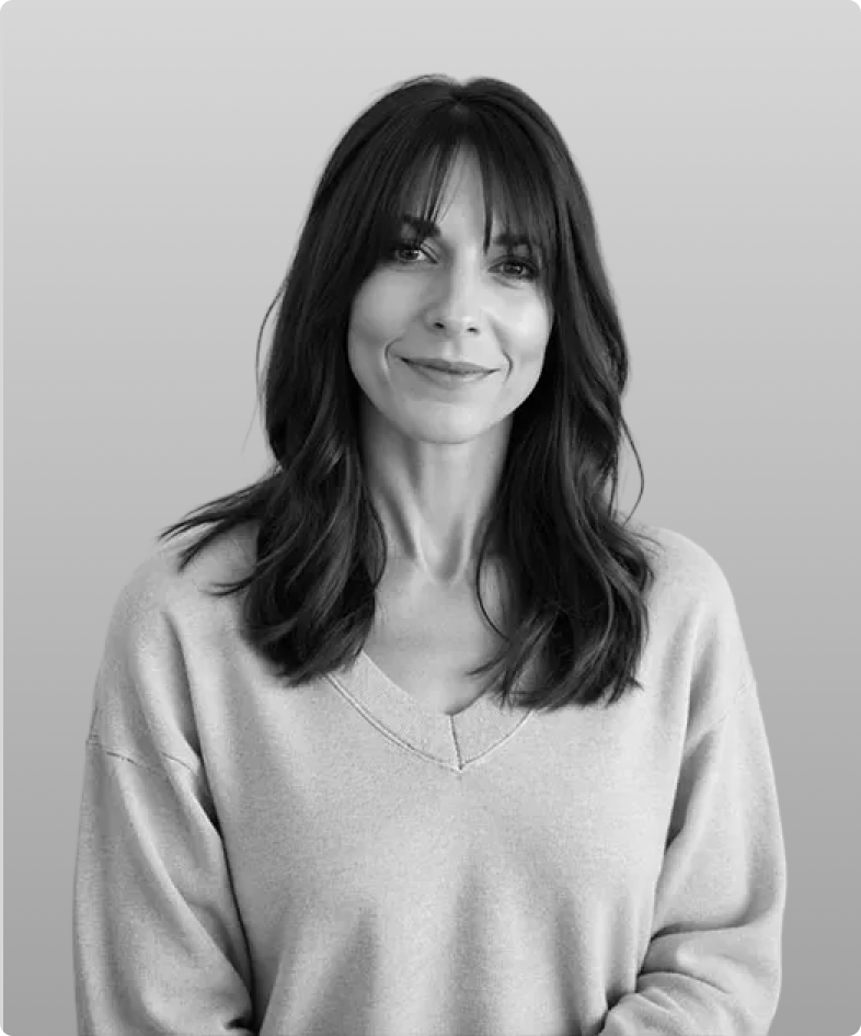 A black and white photo of Kendell Kelton, the Head of Marketing at Rev.