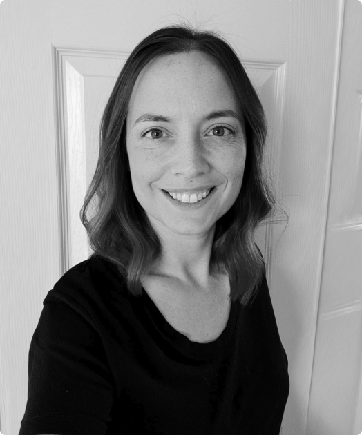 A black and white photo of Cayla Wilkerson, the Head of Operations at Rev.