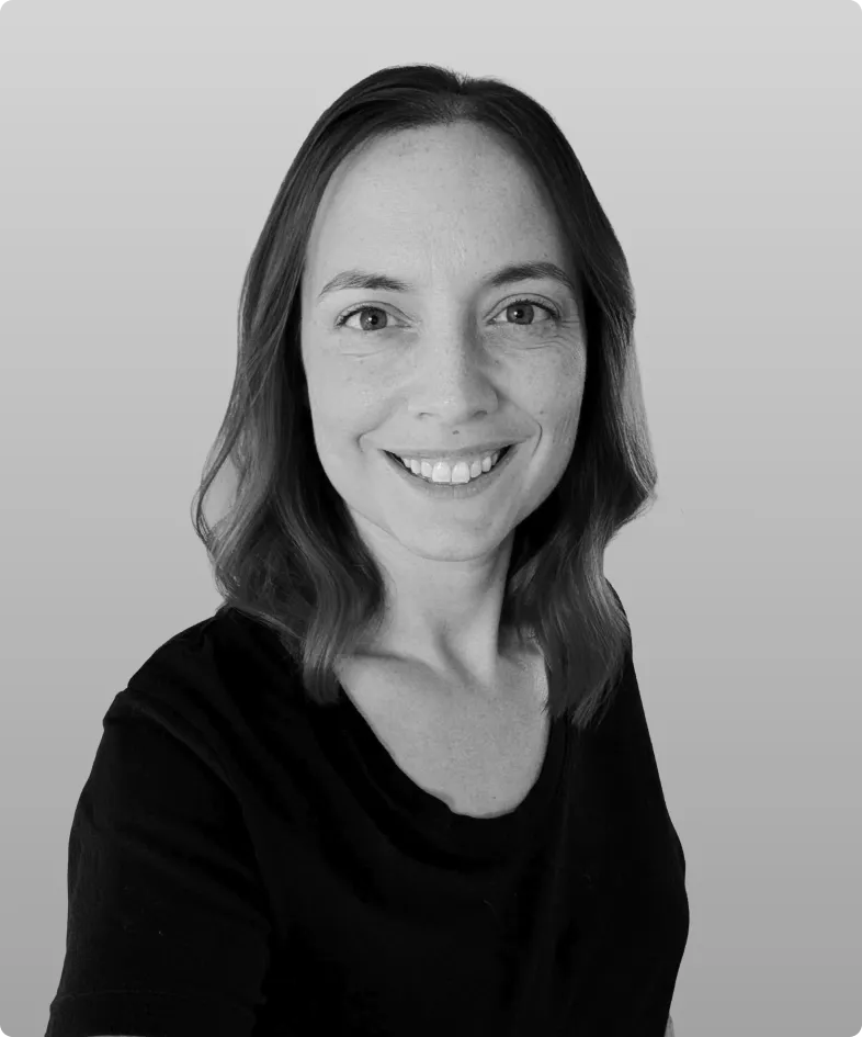 A black and white photo of Cayla Wilkerson, the Head of Operations at Rev.