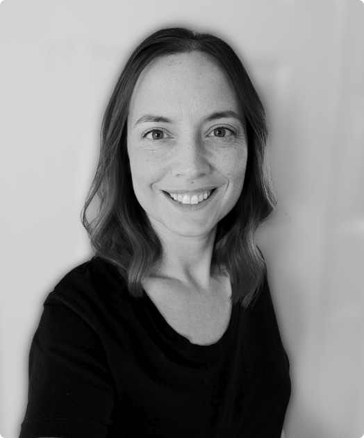 A black and white photo of Cayla Wilkerson, the Head of Operations at Rev.