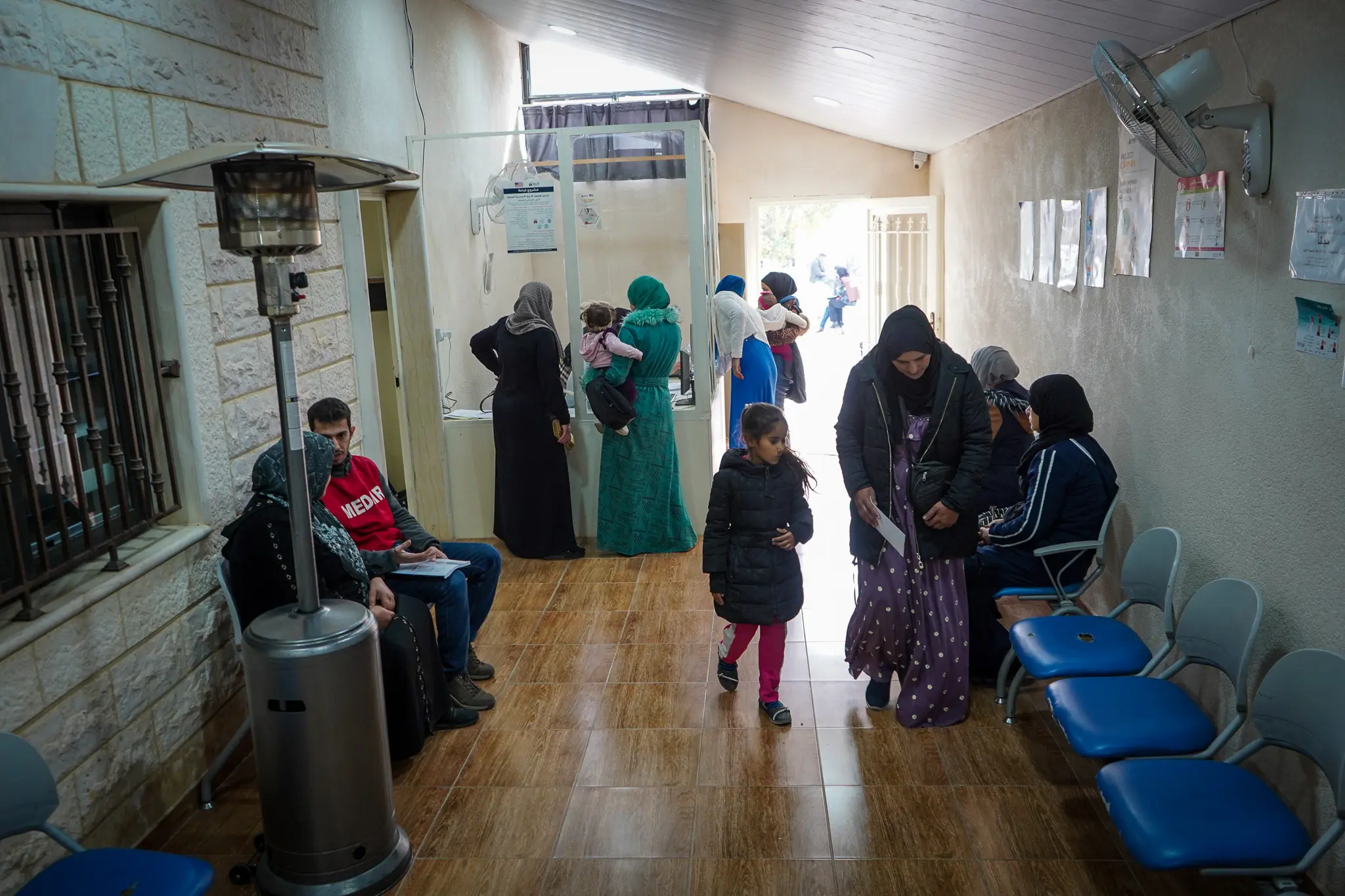 Community members entering a primary healthcare centre in Taalabaya to access health services. 