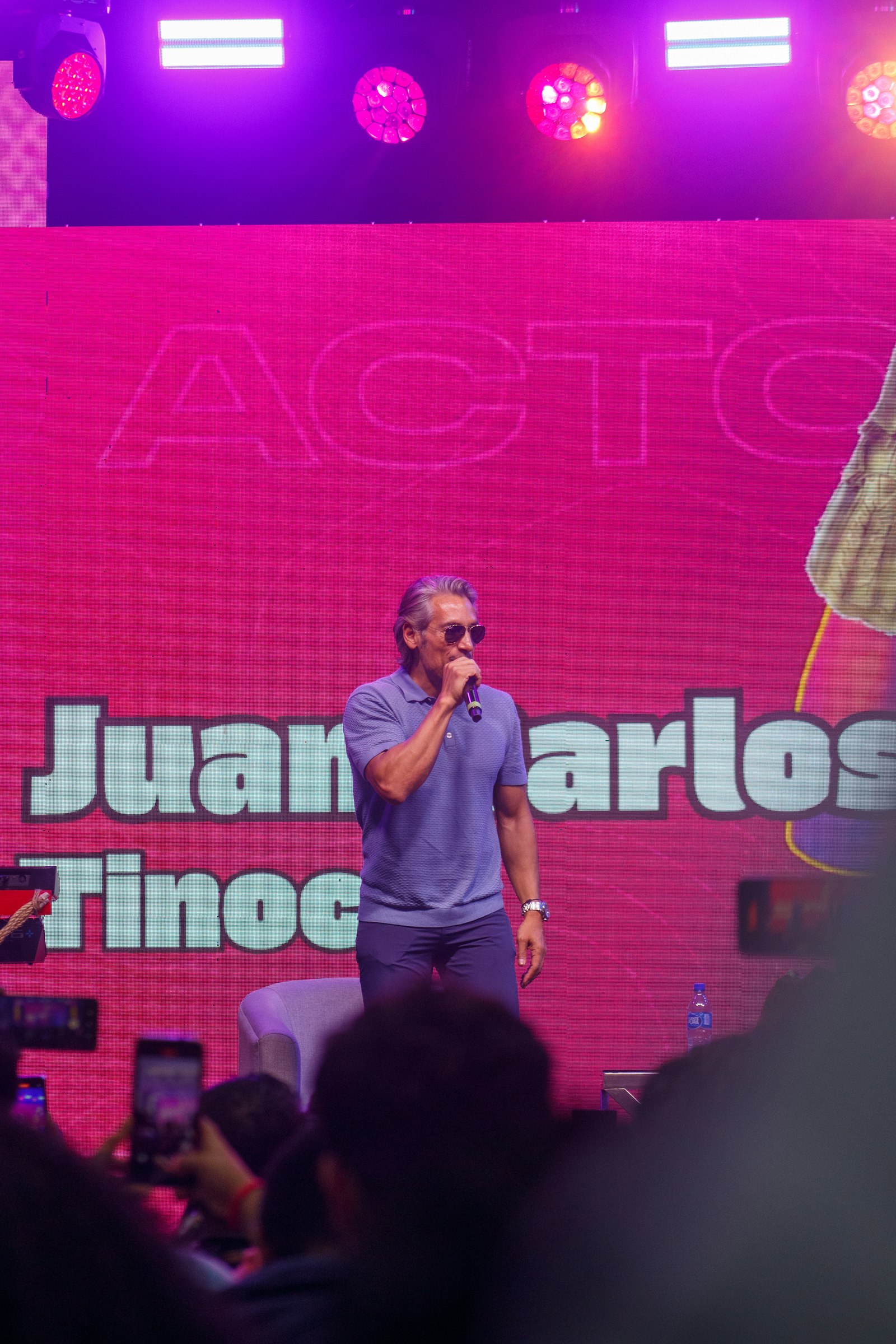 Speaker on stage at a conference, used to illustrate Facebook event cover photo size