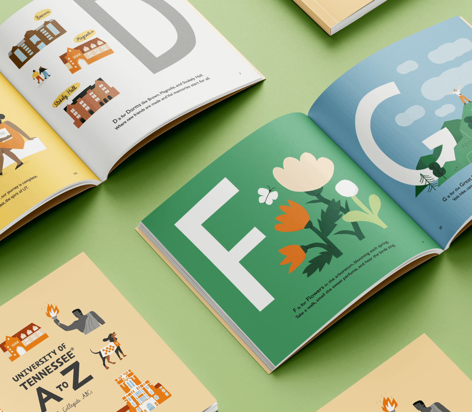 Illustrated Collegiate ABCs books arranged open and closed, featuring colorful campus-themed artwork and typography.