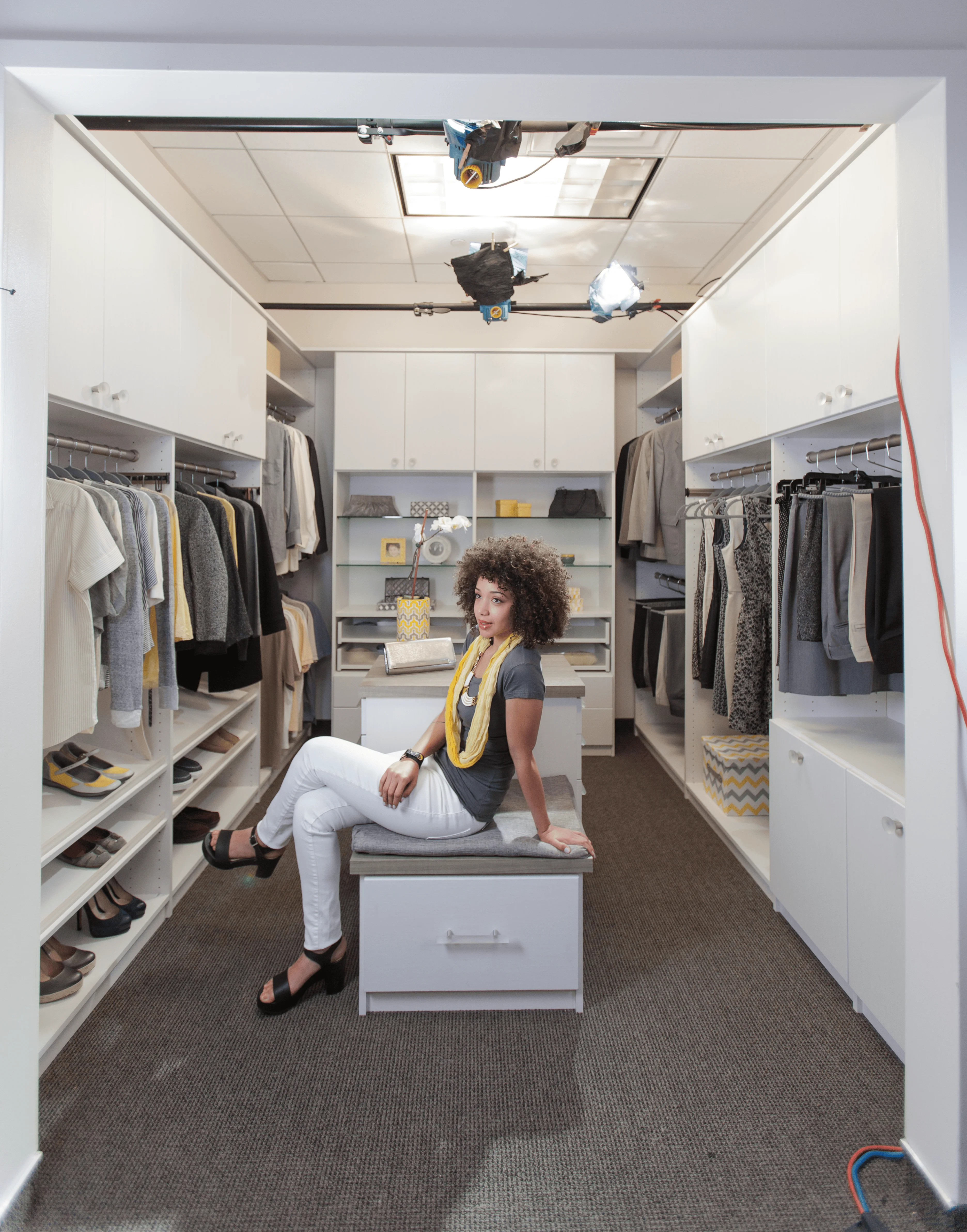 Walk-in closet with cabinet bench