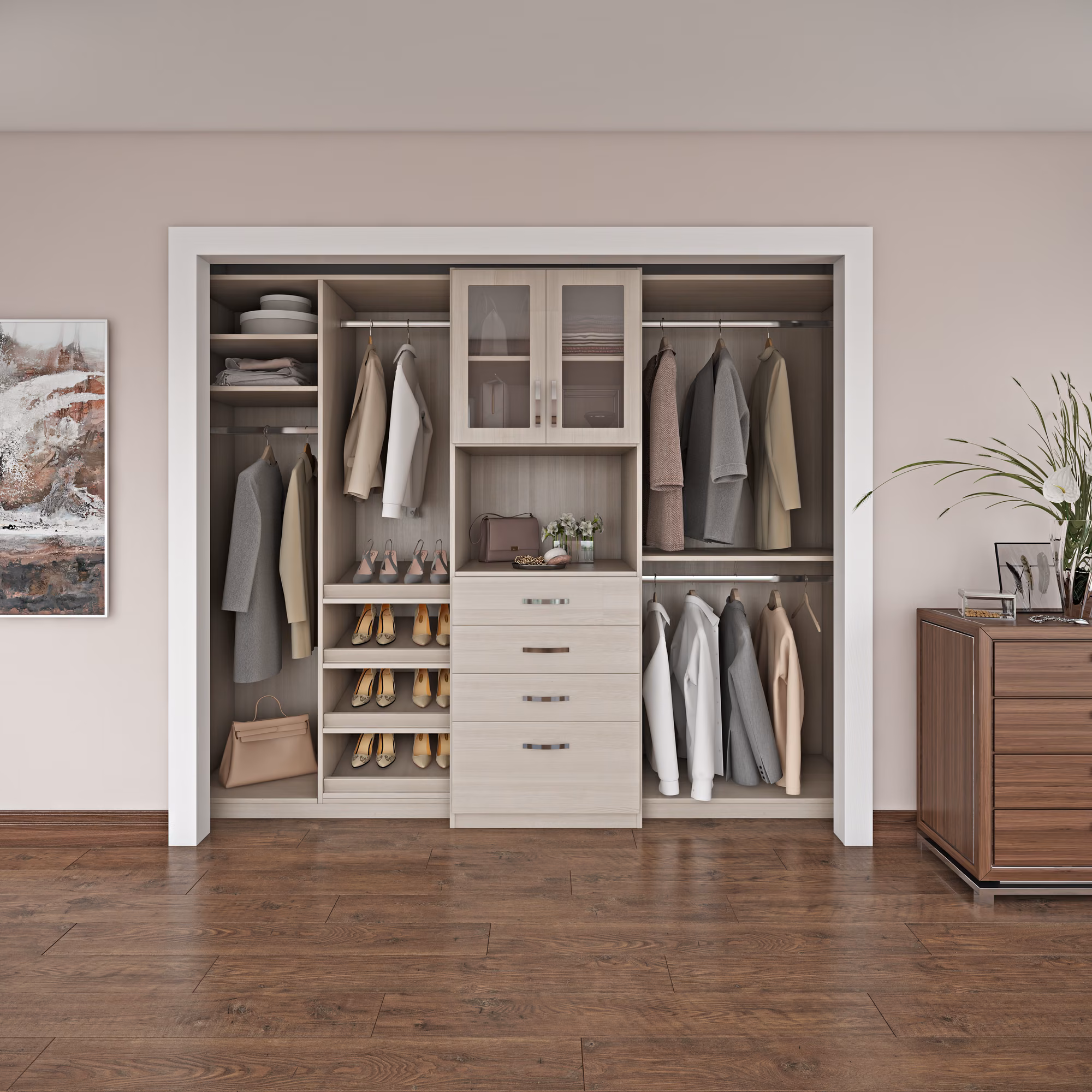 Light wood reach-in closet system in a bedroom with double-hang sections on both sides, a center drawer bank, glass-front upper cabinet, and angled shoe shelves.