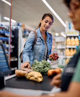 Shopper checking out at grocery store.