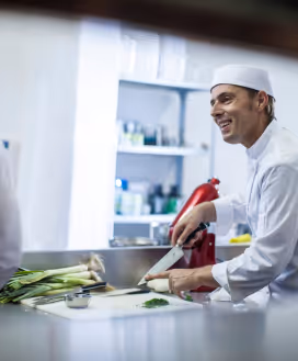 Chef prepping herbs.