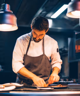 Chef prepping food for service.