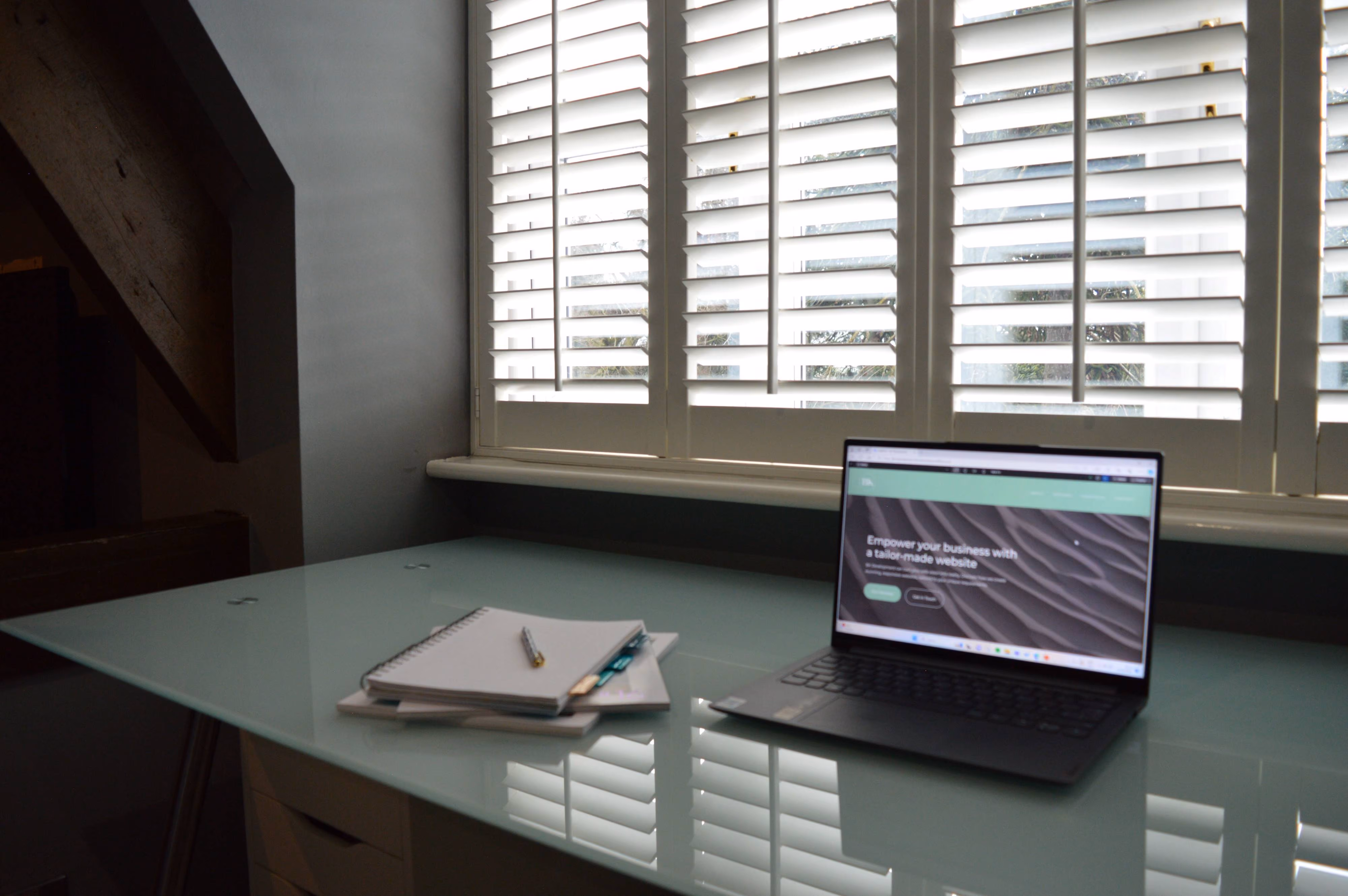 BK Development home page image of a laptop on a desk used for Web Development and Web Design and SEO in Cheshire and North Wales