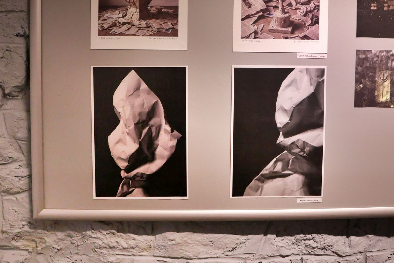 Two images on a poster board that are part of a Mail Art group exhibition.