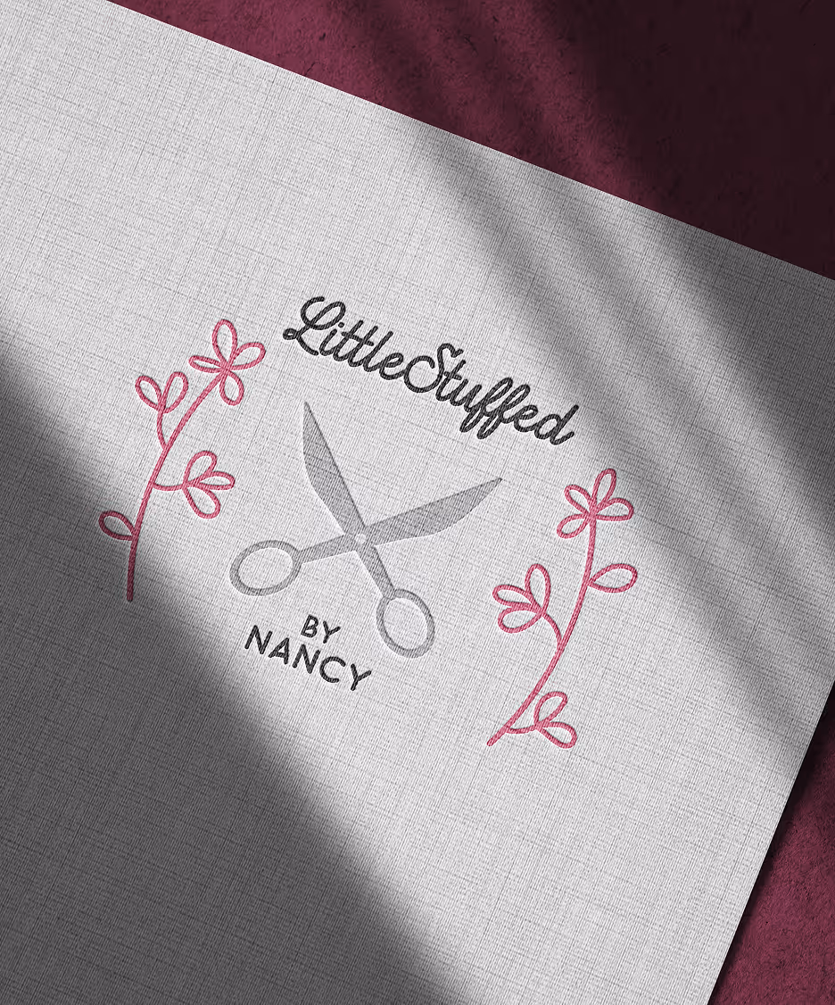 Little Stuffed by Nancy: Hand-drawn scissors with floral accents, paired with playful script to highlight creativity and craft.