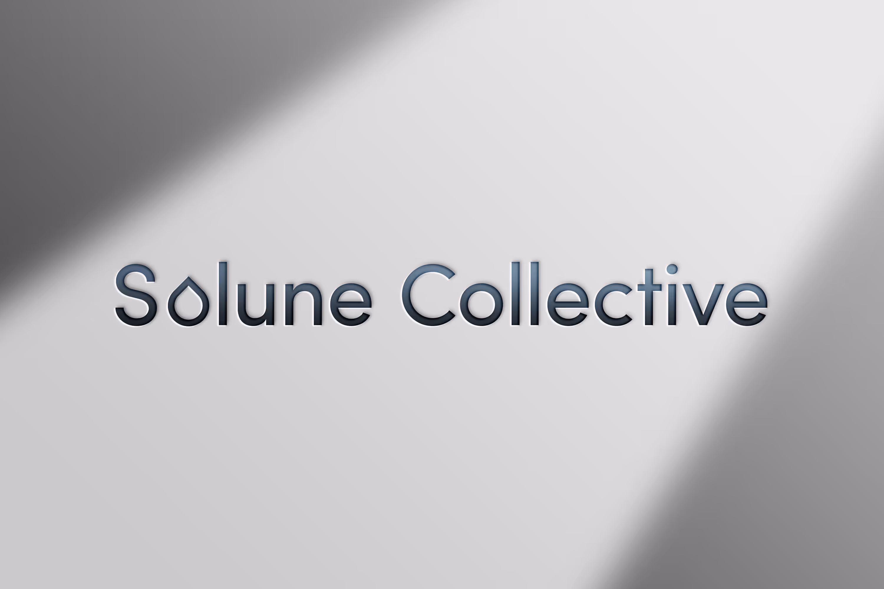 Solune Collective logo, embossed on paper with shadows.