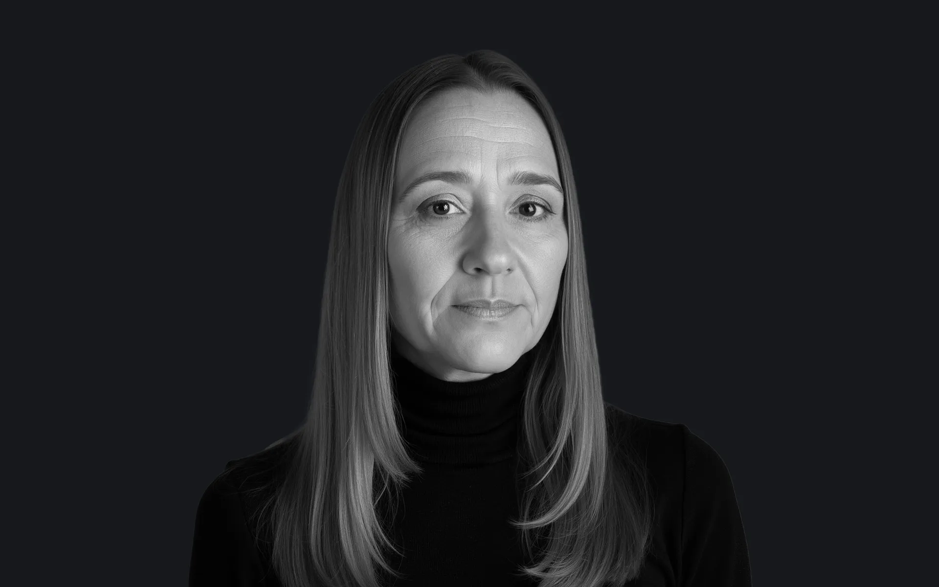 Danni Goodman wearing a black turtle neck.