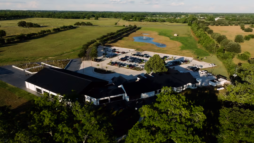 Aerial view of the White Oaks estate, its lake and surrounding trees