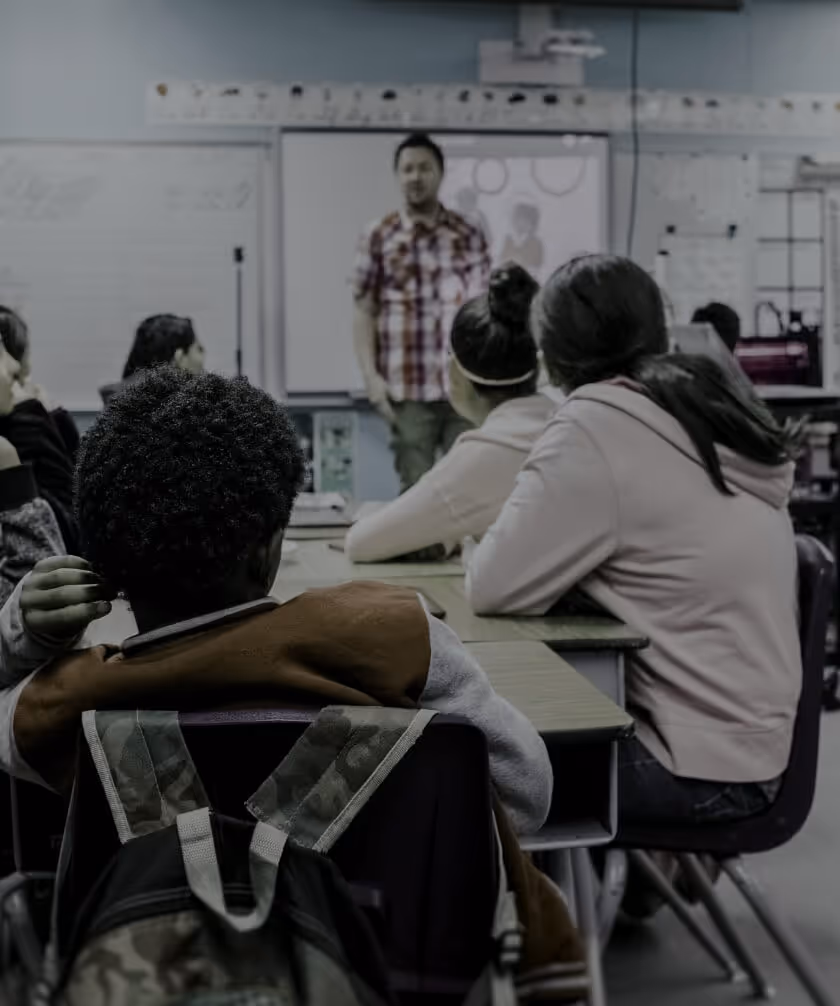 Image of a teacher presenting to a small group of students