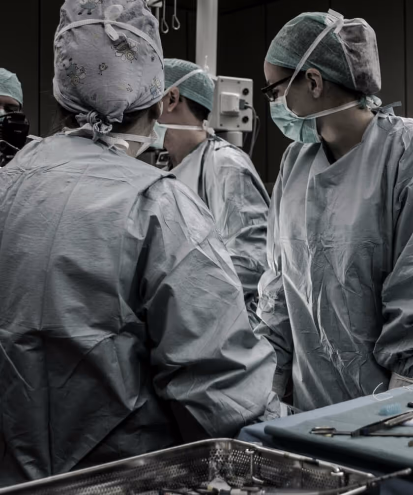 Image of a surgical team operating at a table