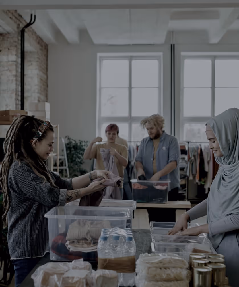 Group of non-profit volunteers gathering care packages of food