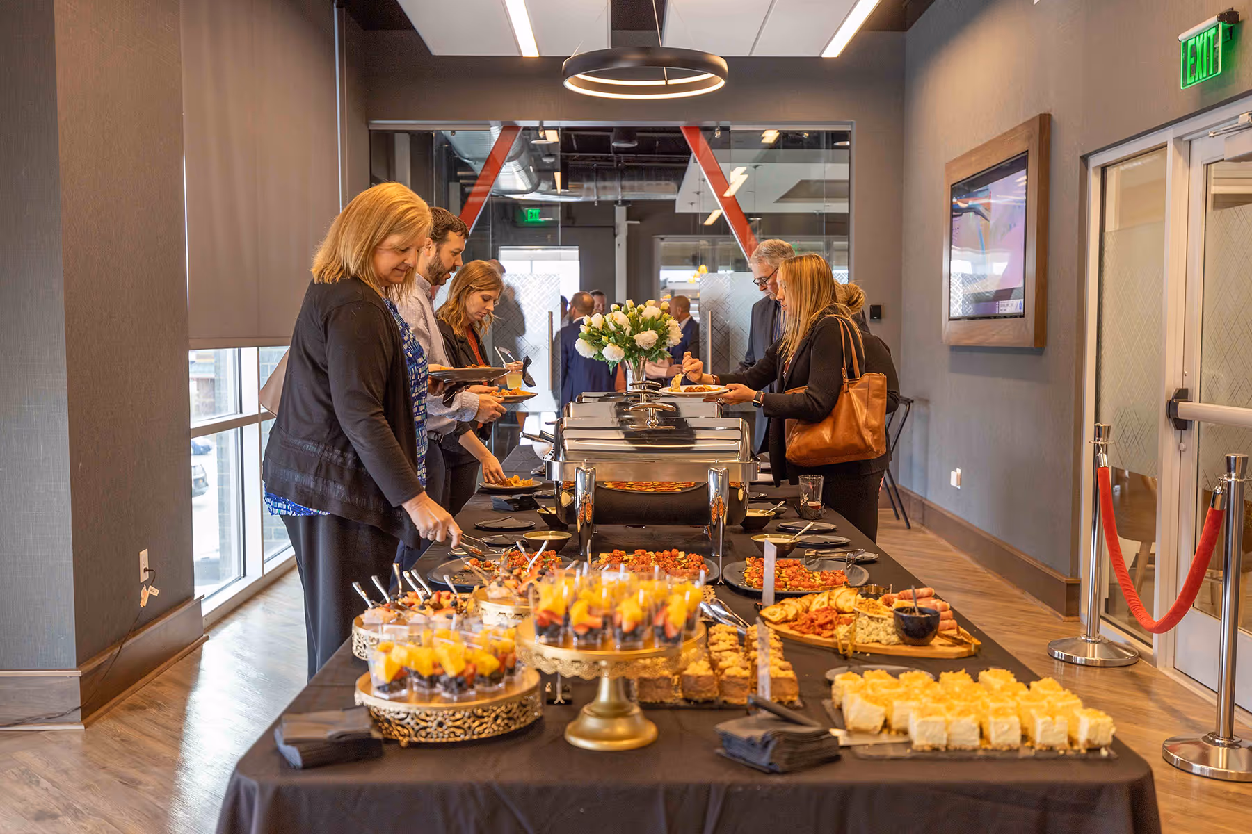 Guests enjoying a catered event in the Boardroom event space at DG