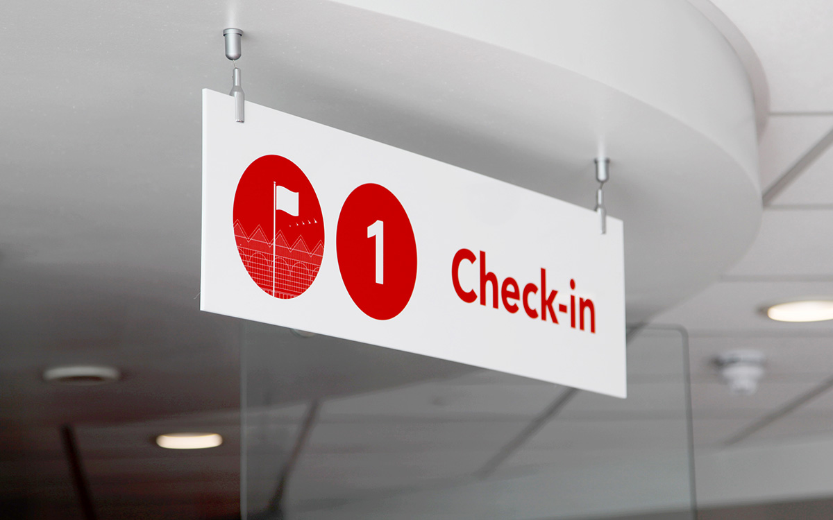 Colour coded and numbered check-in signage in emergency department.