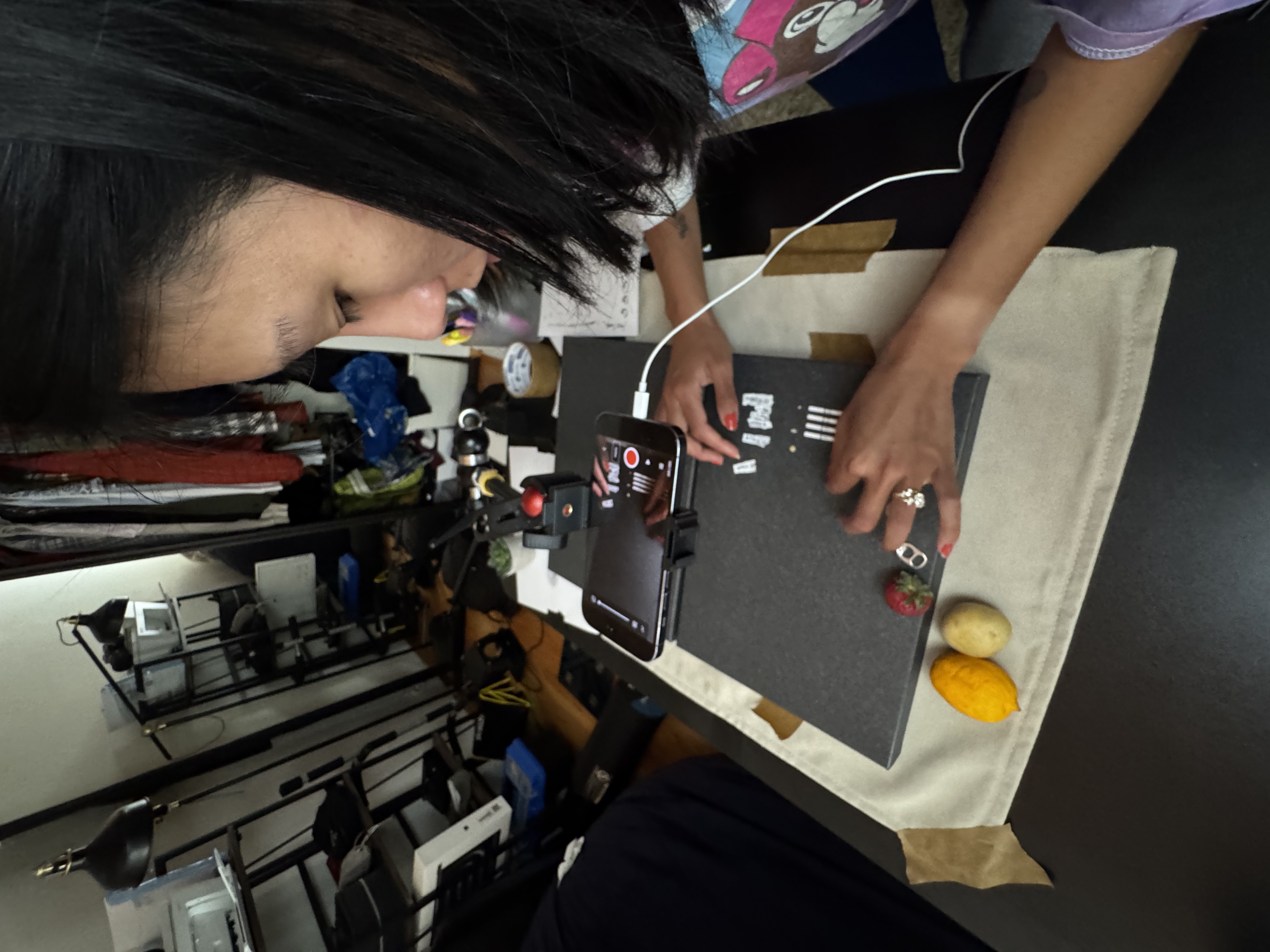 And action shot of Heather moving paper into the frame filmed with a mounted iphone.
