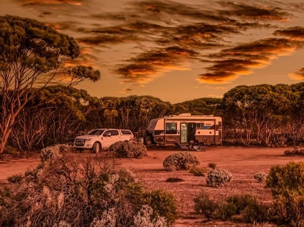 a truck parked in the middle of a desert