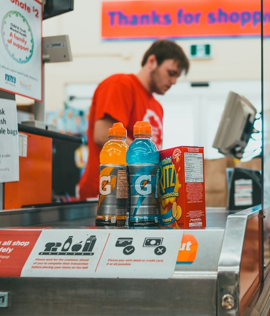a man standing at a cash register in a store