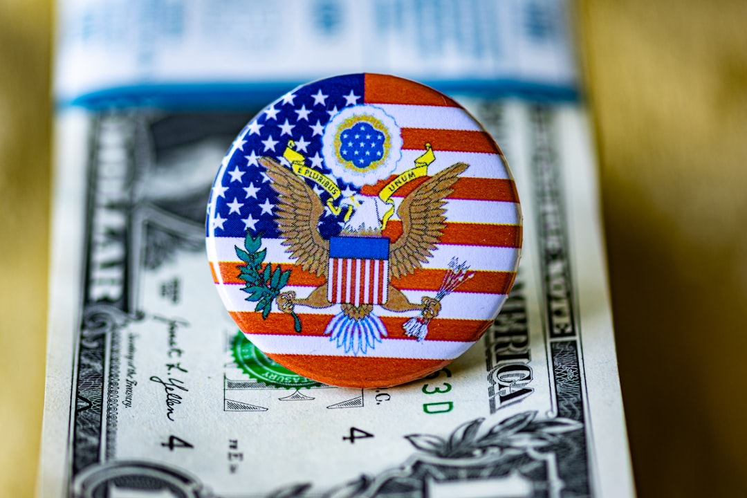 A close up of a button on a dollar bill
