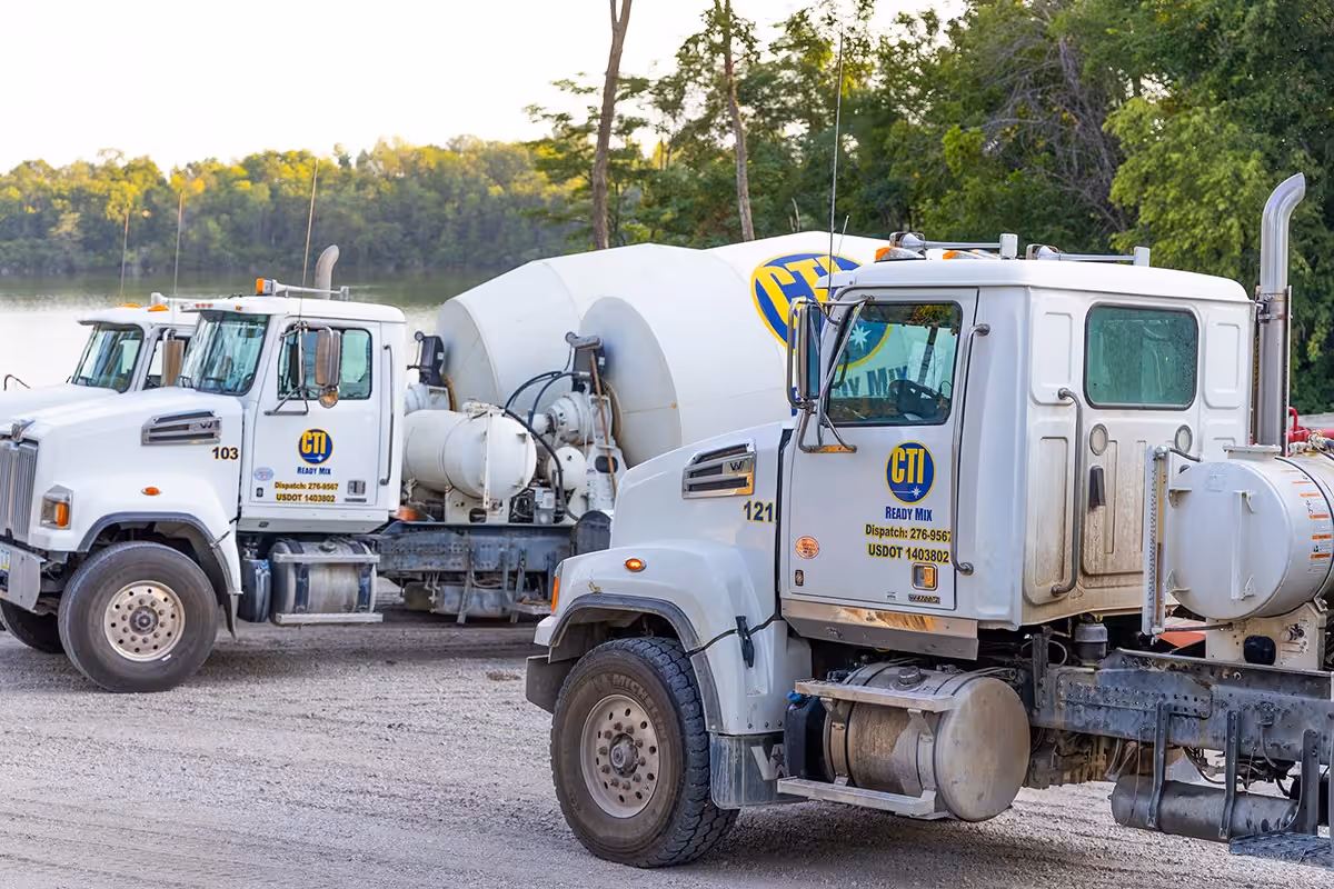 CTI Ready Mix Plant in Johnston, Iowa, with Concrete Delivery Trucks parked by the pond