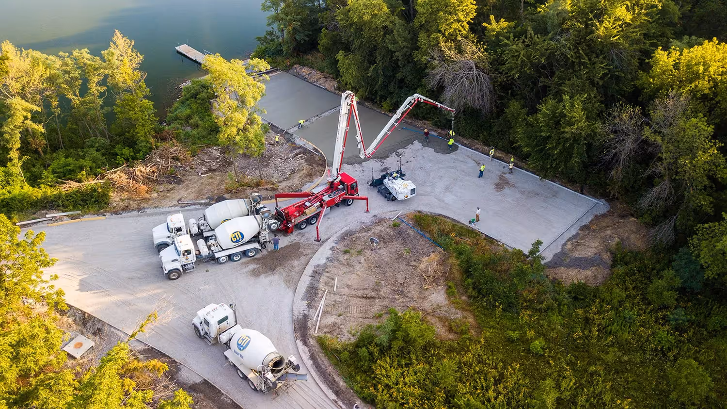 Public works concrete provided by CTI in Cumming, Iowa pouring concrete near a lake boat entrance