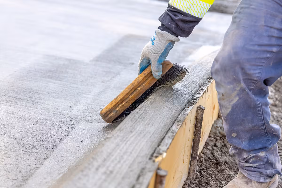 CTI high-quality ready-mix employee brushing concrete services in Waukee, Iowa