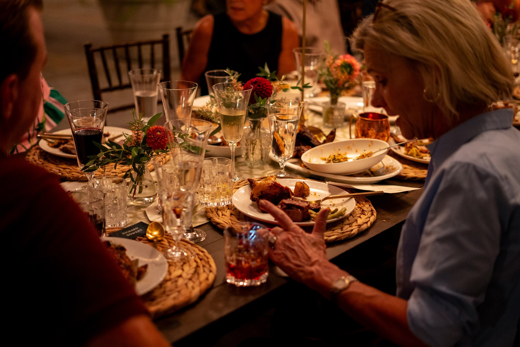 Guests sharing a family-style dinner at Happy Valley Farms