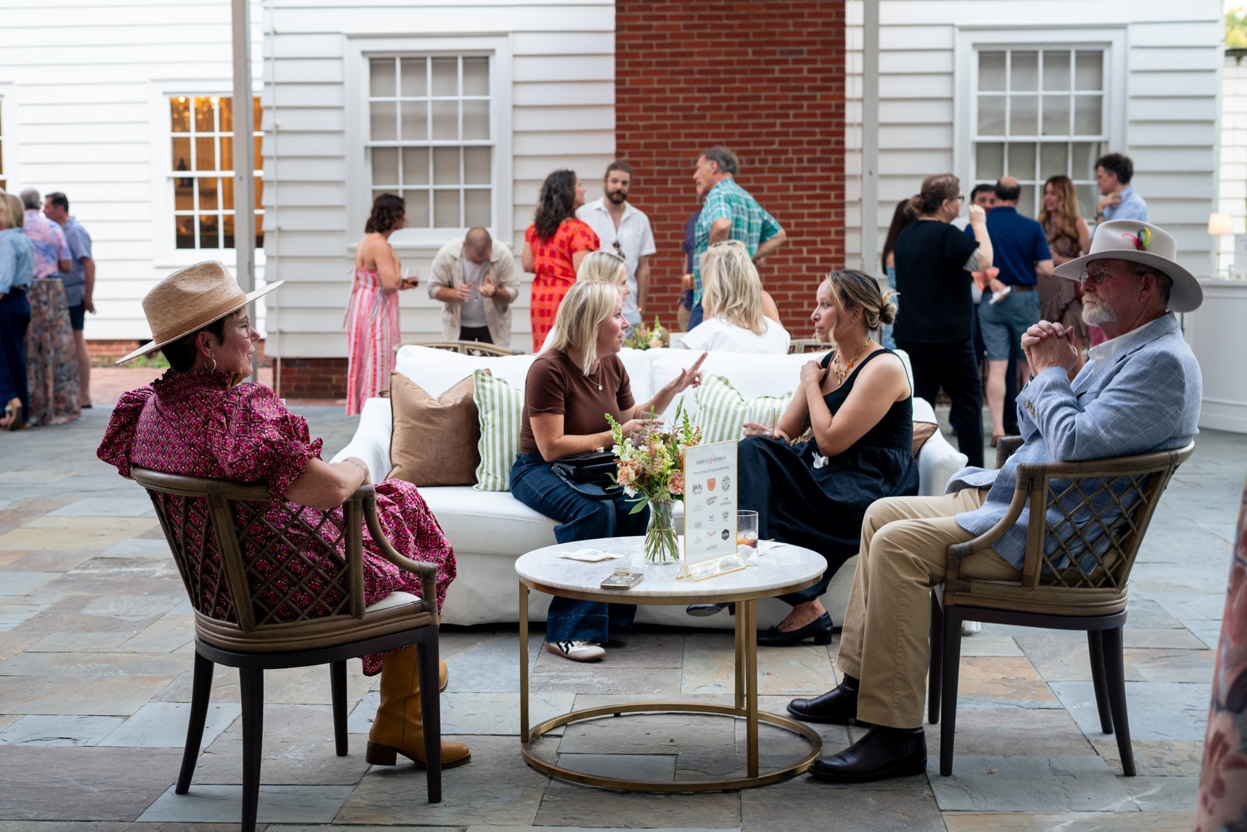 Guests enjoying cocktail hour beside Hutcheson Hall