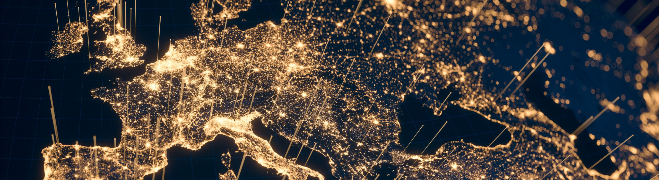 Nighttime map of UK and Europe glowing with illuminated city lights and connection lines.