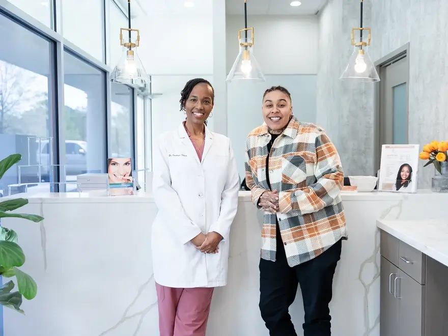 Dr. Tabani smiling with patient at A-Z Dental Art Studio