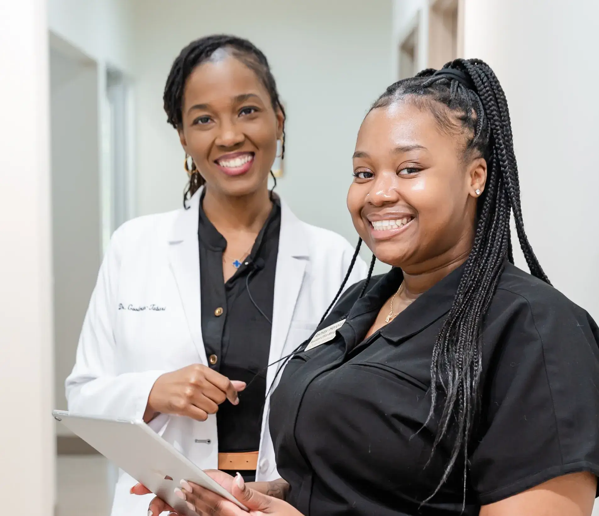 Dr. Ashlee Goodman-Tabari with a team member at A-Z Dental Art Studio